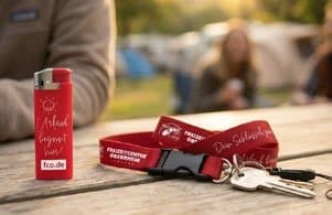 Werbemittel des Freizeitcenters Oberrhein: Feuerzeug und Schlüsselband